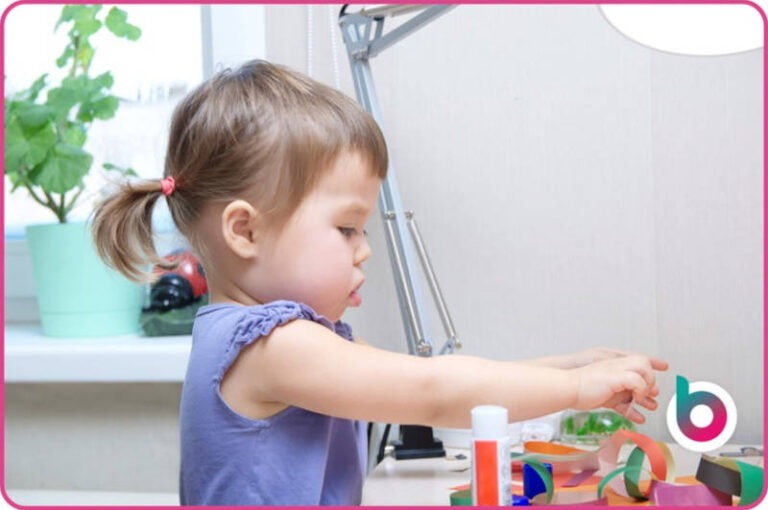 girl making paper chains