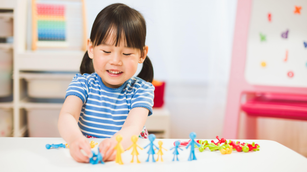 child playing with figurines 
