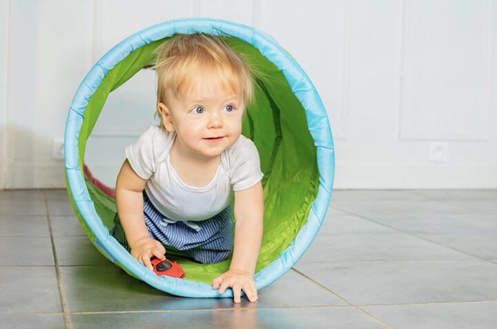 EYFS-Physical-development-activities-Balance-and-coordination child crawling through a tunnel