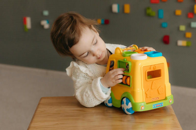 EYFS-Transport-Activities-Image-Child-with-a-toy-car