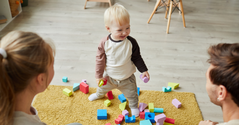 boy playing with two adults
