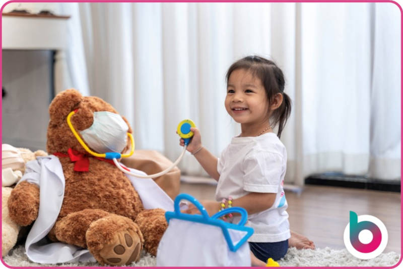 First-aid-image-a-child-administering-first-aid-to-a-teddy-bear