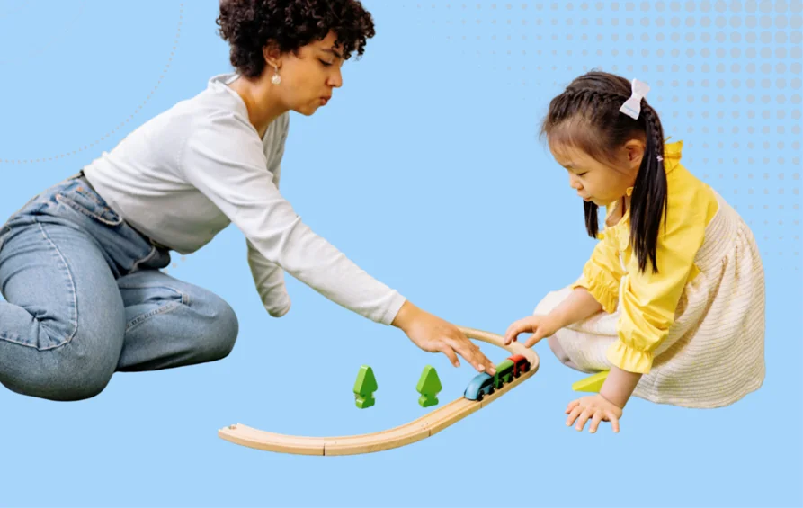Inclusive Practice in early years image - adult and child playing with wooden railway