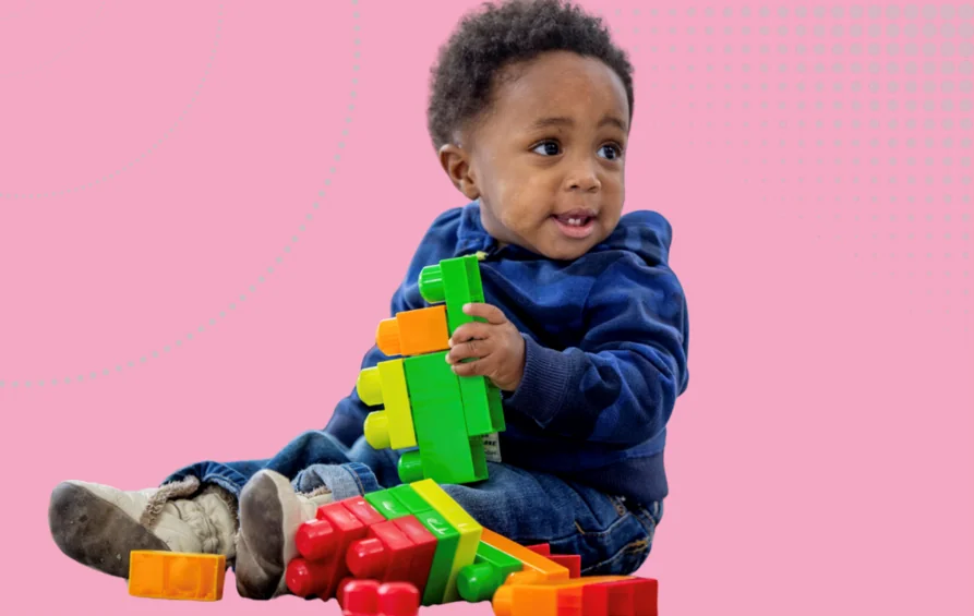 Inclusive Practice in early years image - child playing with interlocking blocks