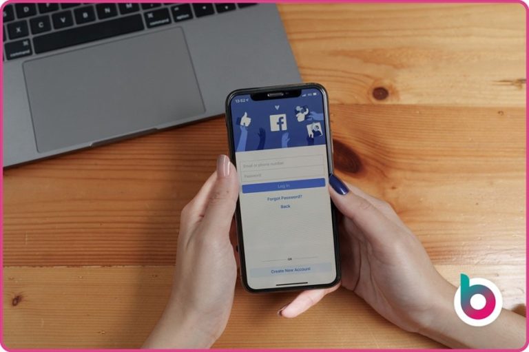 Using-facebook-image-womans-hands-holding-facebook-phone