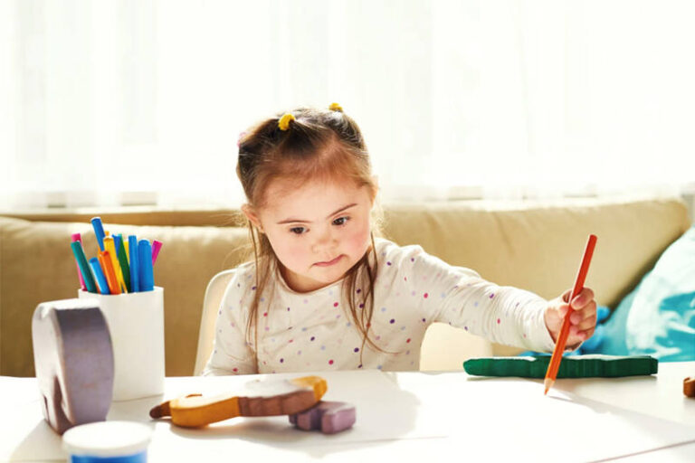 child-drawing-on-white-table
