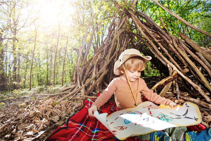kid-reading-a-treasure-map-outdoors-EYFS-Maths