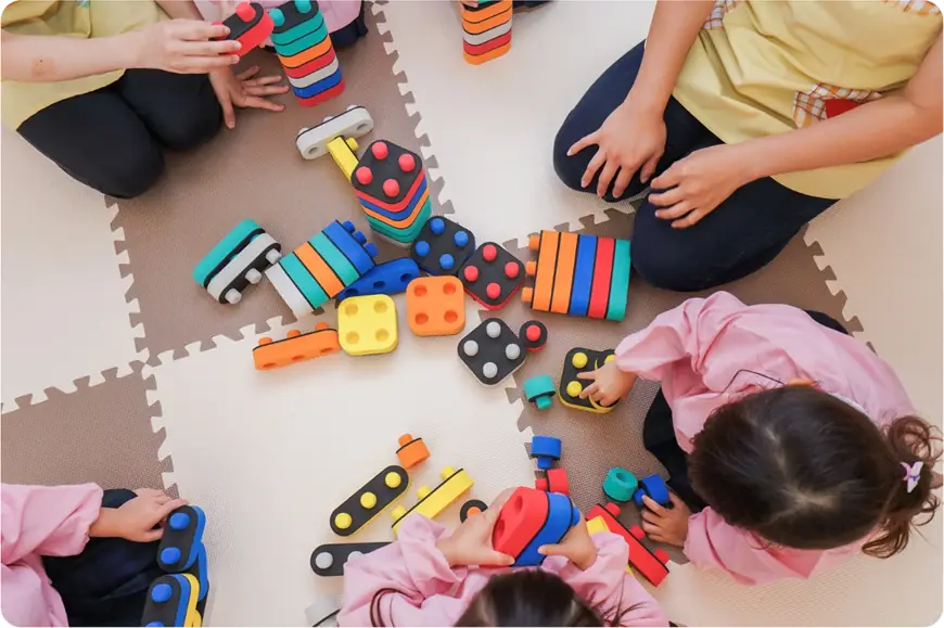 Ofsted Preparation call image - children playing with stackable blocks