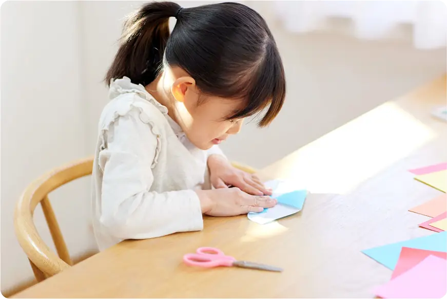 Ofsted Preparation call image - toddler doing paper craft