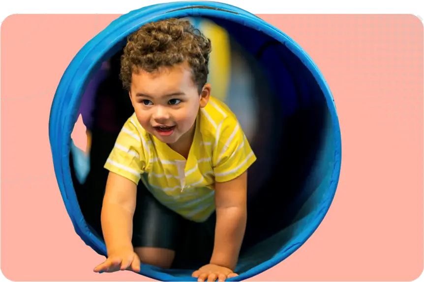 Ofsted Activities to expect image - a child crawling through a play tunnel