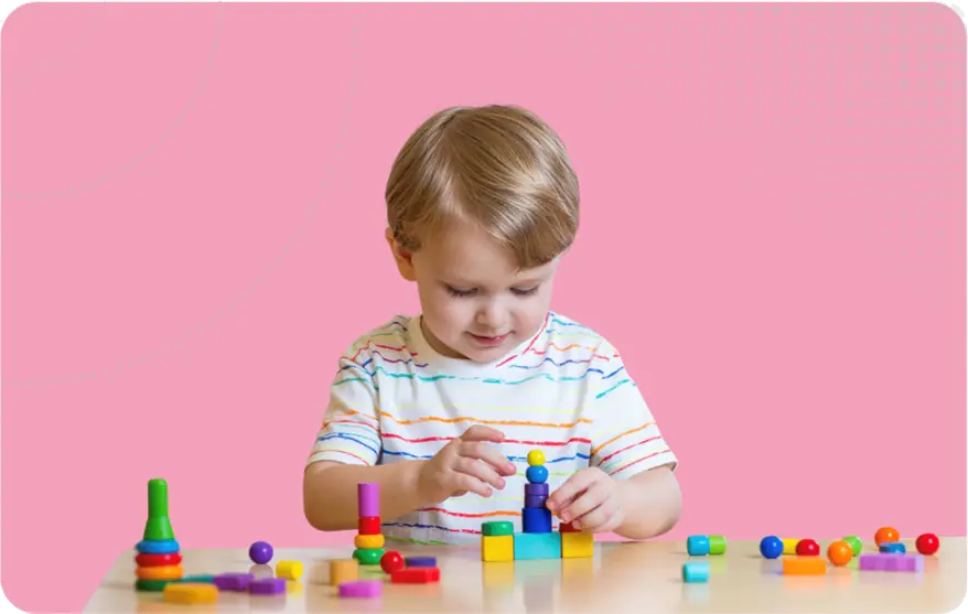 Ofsted Activities to expect image - a child playing with very small blocks