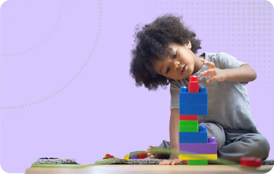 SEND Reform image - A child building a tower from stacking blocks