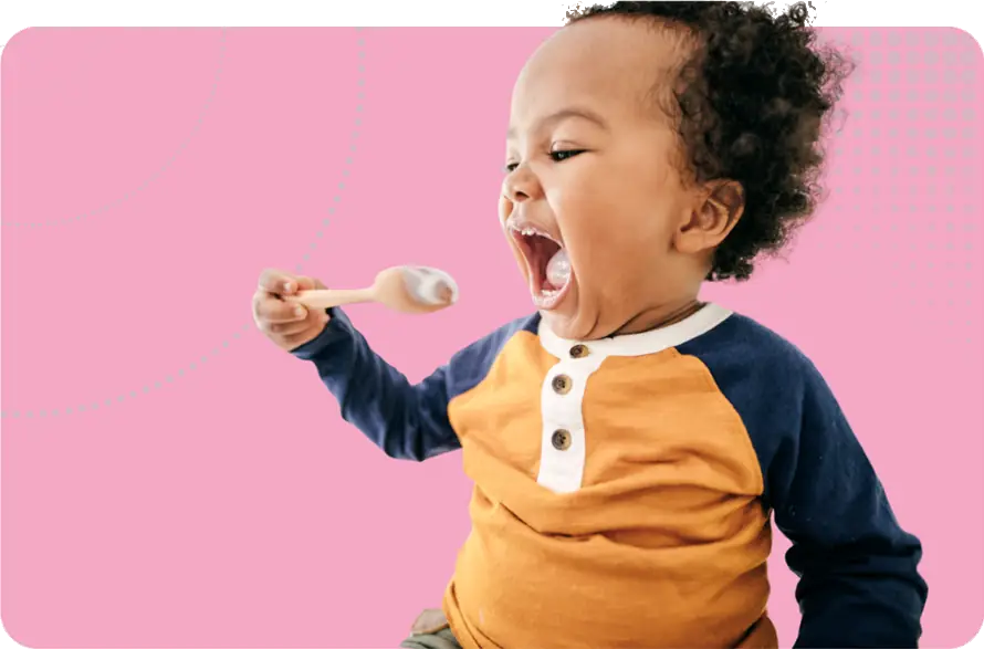 SEND Reform image - a child with a spoonful of yoghurt and a mouth OPEN WIDE