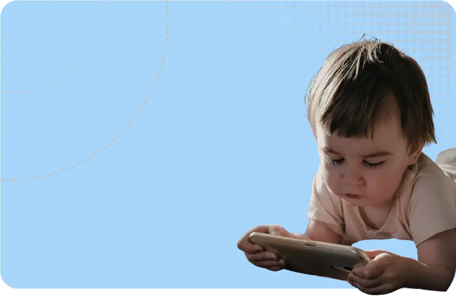 SEND Reform image - a toddler lying down holding a phone in landscape