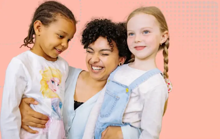 Nursery leadership and governance Image - A woman cuddling 2 young children and being very happy about it