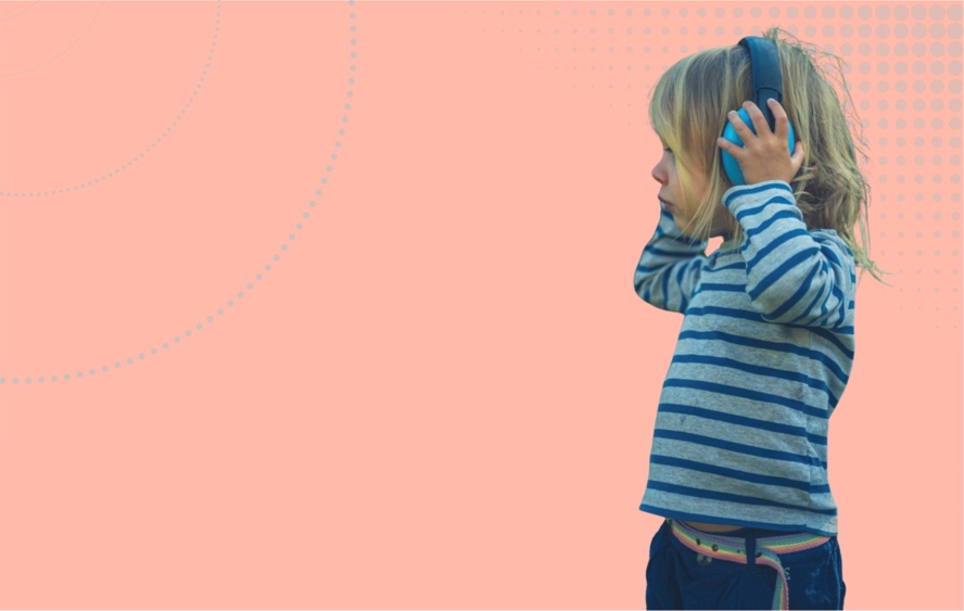 SEND in Early Years image - A small child wearing headphones looking to the left